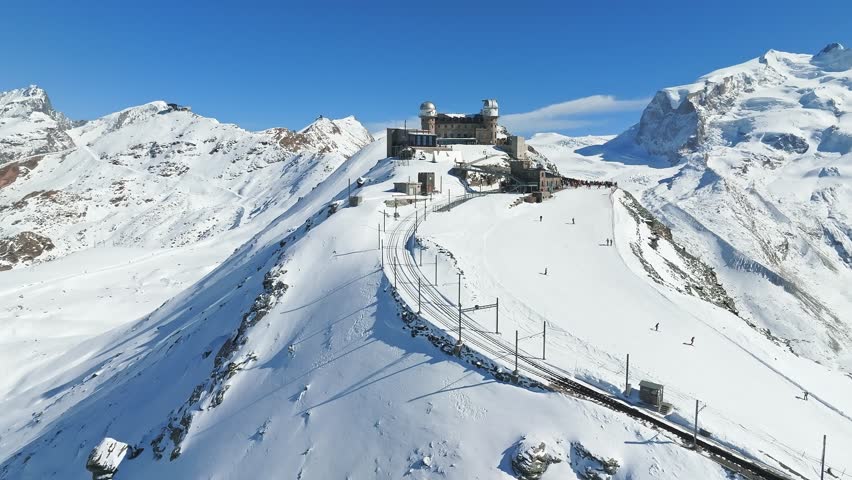 Aerial panorama view of the luxury hotel and the astronomic observatory at the Gornergrat, in the background of the Matterhorn or Cervino mount, Zermatt, Valais, Switzerland, Europe