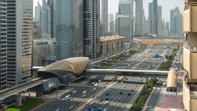 Zoom out timelapse of traffic on Sheikh Zayed Road in Dubai, UAE. The highway is home to most of Dubai's skyscrapers and connects Downtown Dubai to Dubai Marina and the capital Abu Dhabi. - Powered by Shutterstock - Get 15% off with code: PIKWIZARD15