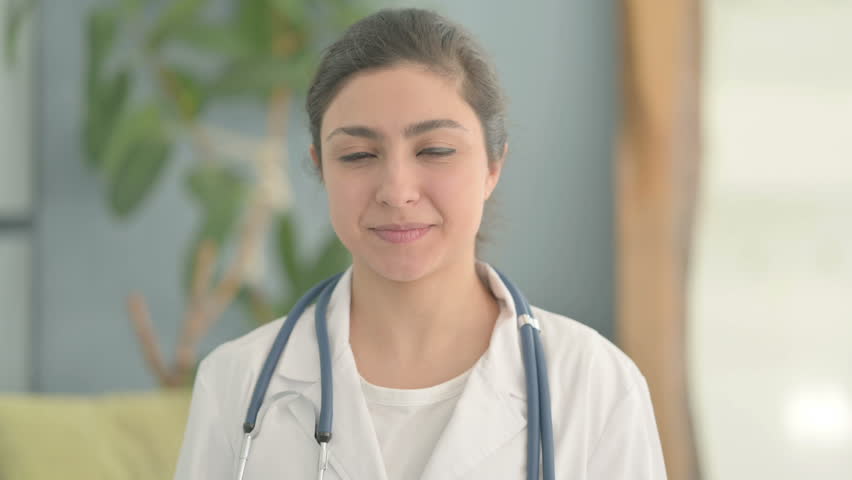 Portrait of Young Indian Doctor Smiling at Camera | Shutterstock HD Video #1101274401
