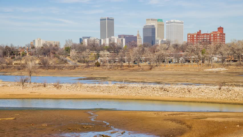 Sunny view of the skyline of Tulsa city from River West Festival Park at Oklahoma