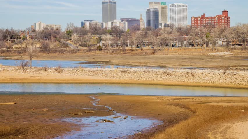 Sunny view of the skyline of Tulsa city from River West Festival Park at Oklahoma