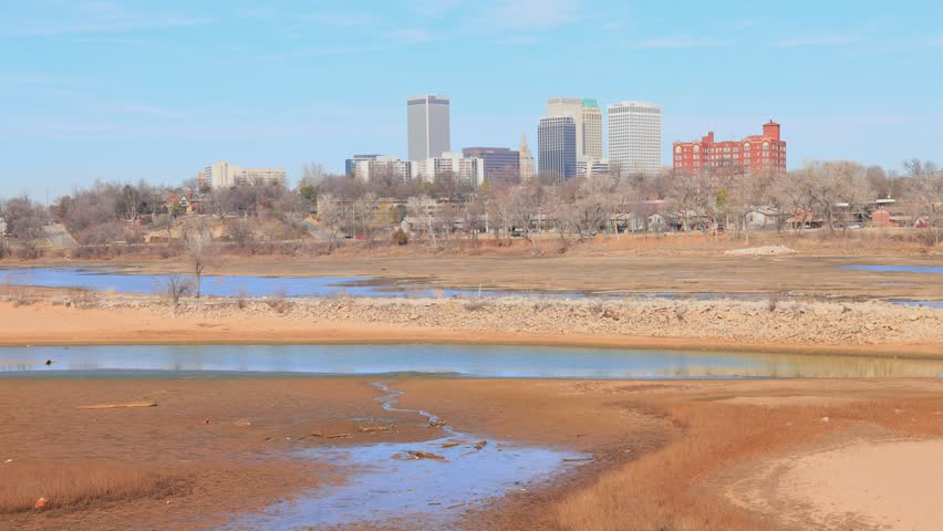 Sunny view of the skyline of Tulsa city from River West Festival Park at Oklahoma