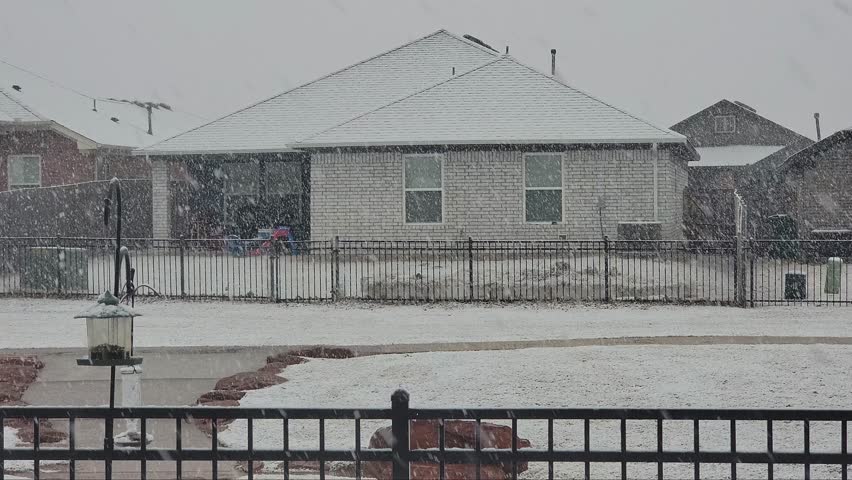 Snowing scenery saw from a house backyard at Oklahoma