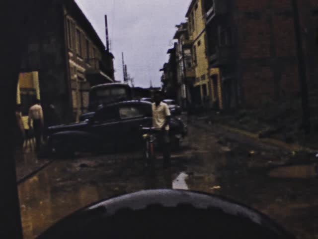 Sainte Anne, Guadeloupe June 1975: Dramatic footage of a devastated Guadeloupe after a tornado hit, destroying buildings and flooding streets.