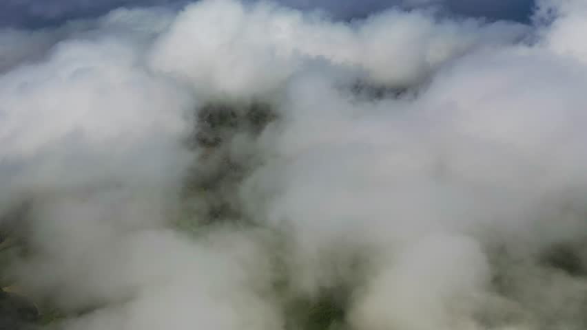 Aerial view of Lagoa Azul lake in low clouds with fog on San Miguel Island, Azores archipelagos, Portugal.