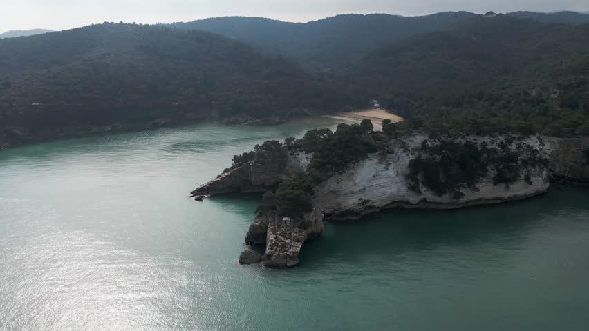 Aerial view of Arco di San Felice, a natural arch along the Ionian Sea coastline, Vieste, Gargano Natural Park, Puglia, italy.