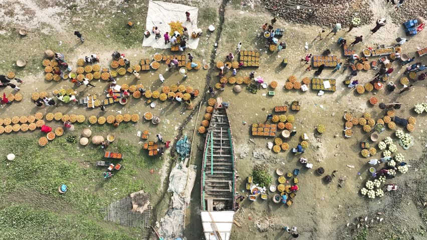 Aerial view of people trading with fruits and vegetables in a local market in Dhaka, Bangladesh.