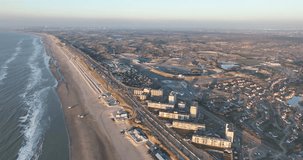 The beautiful coastline of Zandvoort comes to life in this aerial drone video, showcasing the sparkling sea and bustling boulevard.