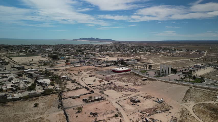 High wide aerial over town of San Felipe Baja California in Mexico and coastal view of Sea of Cortez