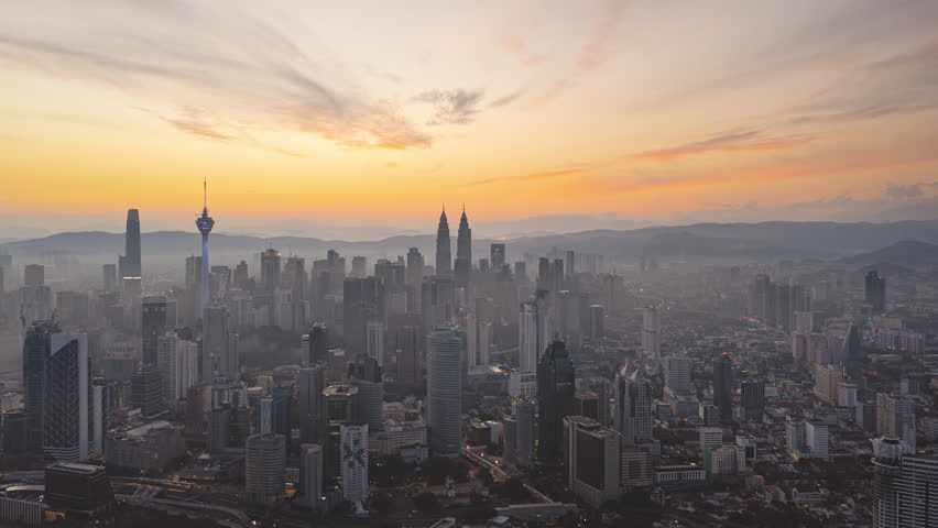 Cityscape Time lapse : Wide angle aerial Kuala Lumpur city view from during sunrise overlooking the KL city skyline in Malaysia. Prores 4KUHD Timelapse. Royalty-Free Stock Footage #1101297987