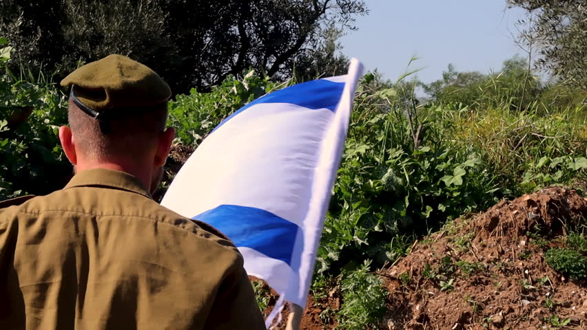 Israeli Soldier runs to the top of the hill and sets the Flag of Israel after which he salutes the Flag. Themes slow motion video: Israel Independence Day, IDF, Army, Soldiers, military, uniform Royalty-Free Stock Footage #1101307251