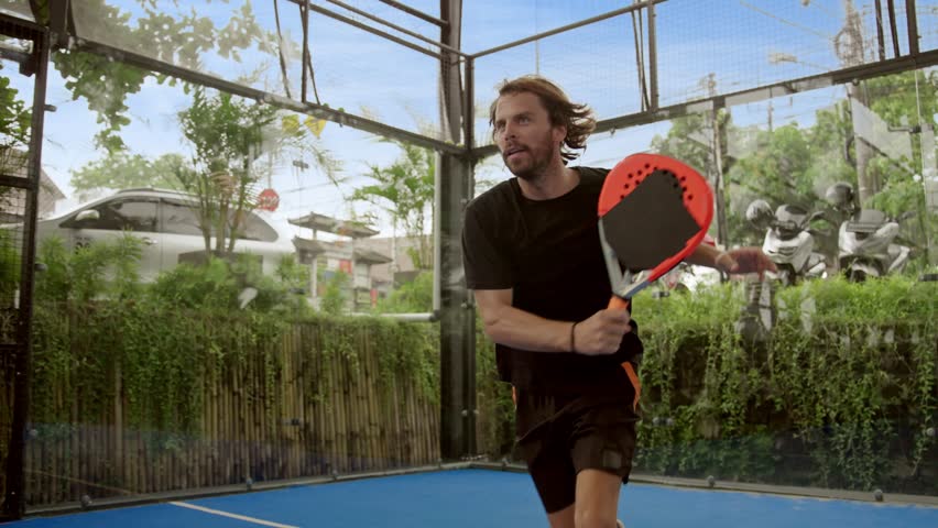 Man player serve ball close up. Young adult guy play tennis slow motion. Male person racket beat game. People hitting sport court match. Fit care free time. Run skill club. Padel tennis slow mo Asia. | Shutterstock HD Video #1101310835