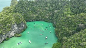 4k Video,Aerial view, High angle view of Koh Hong Lagoon a nd green-covered gorge in the blue-green sea.Ko hong island lagoon Thailand