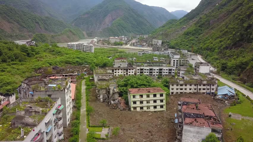 Aerial shot viewing damaged residential buildings after the earthquake hit in Sichuan province of Lidung County, China. 
