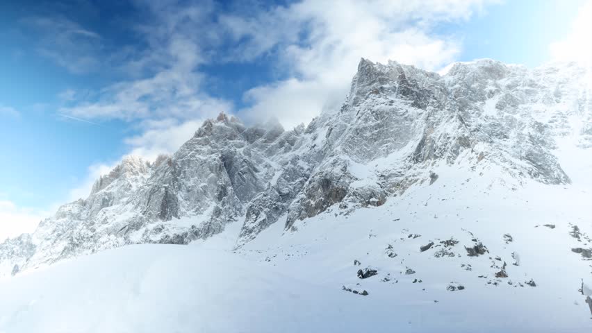 Time Lapse oF Snowy Alps Mountains With Blue Sky and Light Clouds 