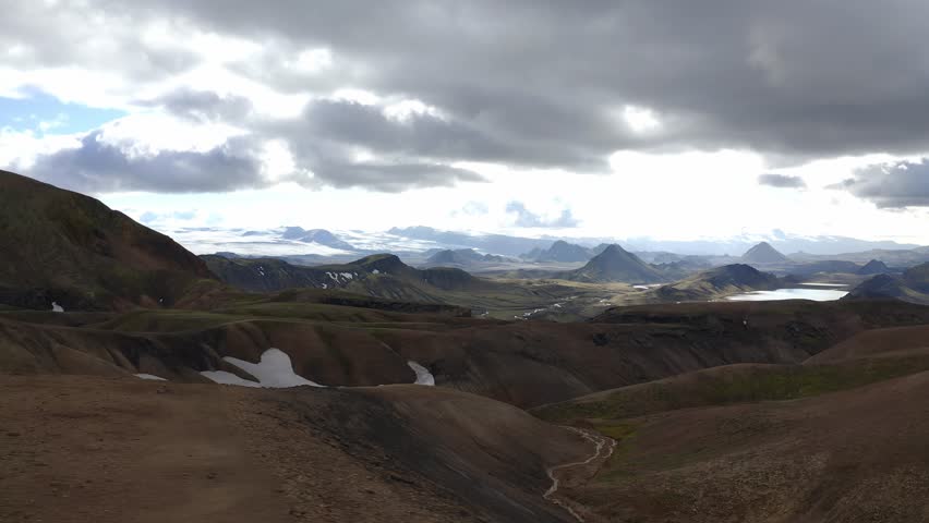 Aerial: Majestic View in to Valley Glacier in Background Highlands of Iceland Hiking trail Laugavegur 