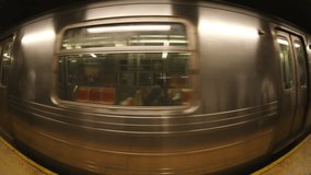 Fisheye shot of a new york subway train coming into the station - Powered by Shutterstock - Get 15% off with code: PIKWIZARD15