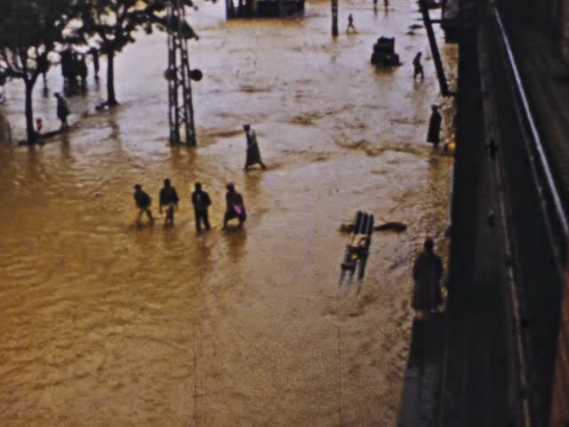 Sainte Anne, Guadeloupe June 1975: Dramatic footage of a devastated Guadeloupe after a tornado hit, destroying buildings and flooding streets.