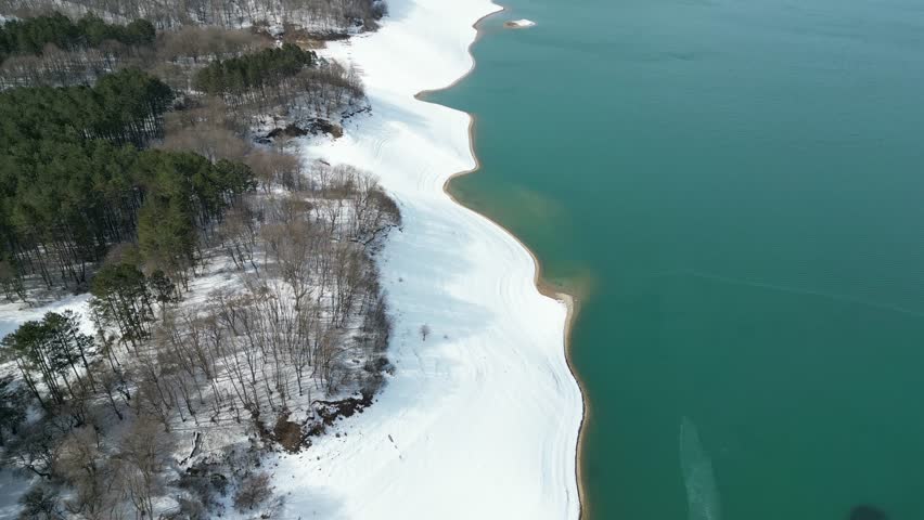 Sioni lake(reservoir) with blue water and snow