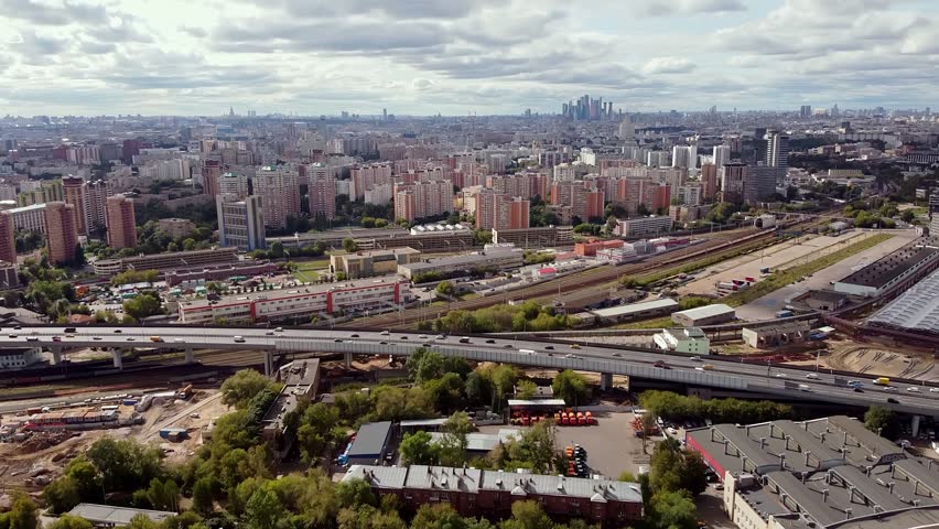 Air view of the Moscow area with developed infrastructure. Landscape with a view of the railway tracks against the background of the metropolis