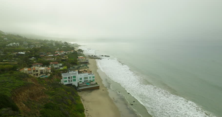 Drone flyover waves crashing on rocky beach, The El matador beach in Malibu, California. Deserted Wild El Matador Beach Malibu California Aerial Ocean View - Waves with Rocks.  Scenic View Of Cliffs. 