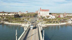 Aerial view of St. Augustine, Florida with forward camera motion along the Bridge of Lions and Cathedral Place.