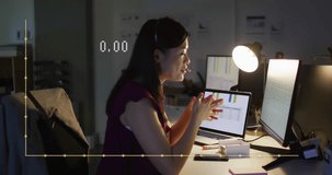 Animation of financial data processing over asian businesswoman working in office. Global business, finances, computing and data processing concept digitally generated video.
