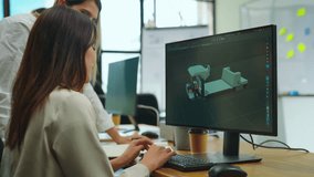 Female designer using computer to design ev car prototype at office. She used a 3D model to create a car model. - Powered by Shutterstock - Get 15% off with code: PIKWIZARD15
