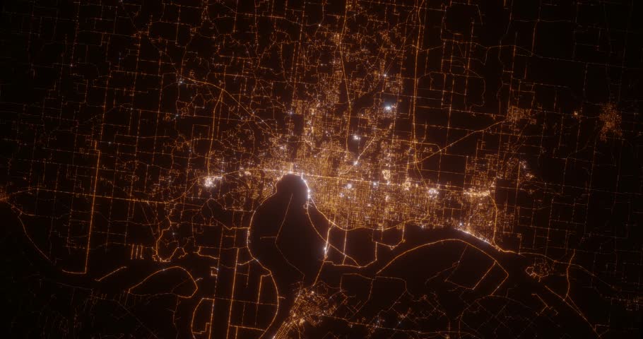Evansville (Indiana, USA) aerial view at night. Top view on city from space. Camera is zooming in, rotating clockwise
