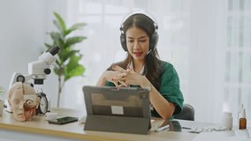 Tele medicine,teledermatology concept,Asian woman Doctor with headset using video call app consultation,online communicating the patient on VR medical interface with Internet Telemedicine technology - Powered by Shutterstock - Get 15% off with code: PIKWIZARD15