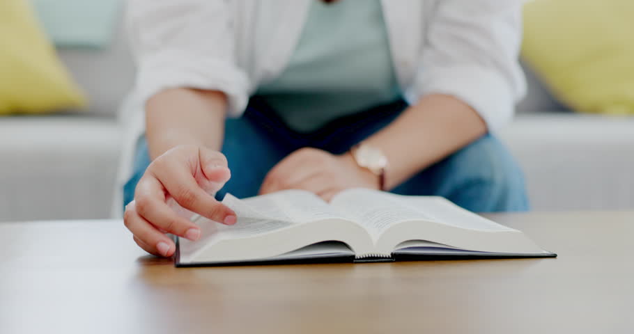 Hands, bible book and table with woman, reading and religion for peace, learning and personal growth. Closeup, paper and worship god with relax mindset on living room sofa in home with education
