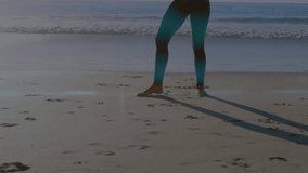 Animation of light spots over caucasian woman practicing yoga at beach. Global sport and digital interface concept digitally generated video. - Powered by Shutterstock - Get 15% off with code: PIKWIZARD15