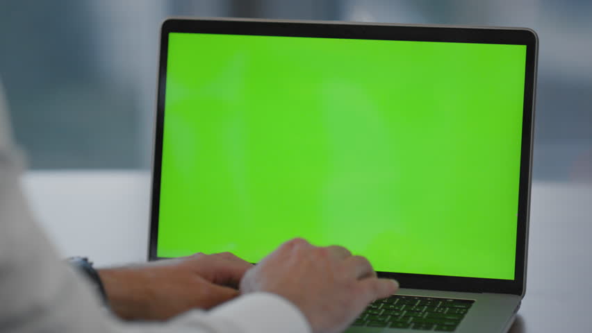 Man hands writing on green screen laptop sitting office close up. Unknown businessman typing document searching information surfing internet using mockup computer. Manager working on chroma key pc. Royalty-Free Stock Footage #1101358899