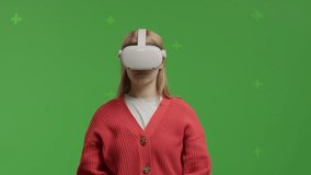 GREEN SCREEN CHROMA KEY Portrait of 20s Caucasian female using VR headset