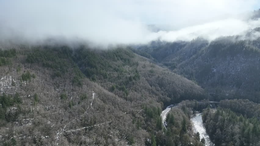 Clouds drift across the scenic coastal range of northern Oregon between Tillamook and Portland. The Coast Range is a series of mountain ranges along the Pacific coast, from Baja California to Alaska.