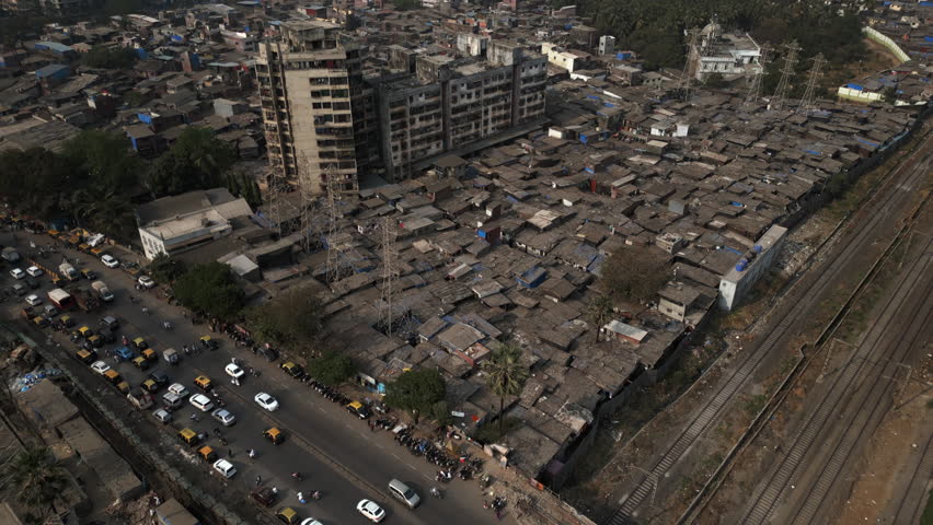 Aerial tilt up shot revealing the Dharavi slums in Mumbai, Maharashtra, India. Dharavi is considered to be one of the largest slums in the world and the largest in Asia.