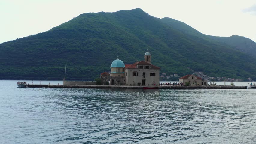 Aerial view island with church in Kotor bay, cloudy weather