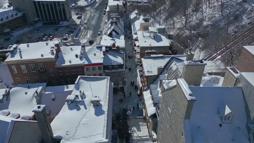 Quebec city in winter. Slow reveal of petit champlain. Drone Shot