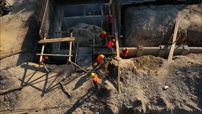 Construction workers in building a city park sewer line in Mexico city, 4K video