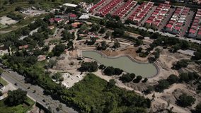 Aerial drone view of unfinished city park construction in Mexico, 4K video.