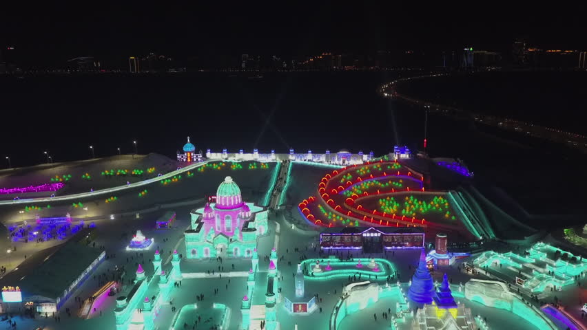 Harbin China night aerial: Bright colors of cold winter ice festival