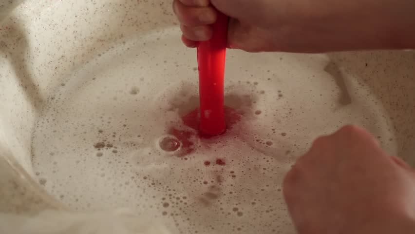 Unblocking the kitchen sink with vacuum apparatus, a person unblocks the sink with a vacuum, Royalty-Free Stock Footage #1101373063