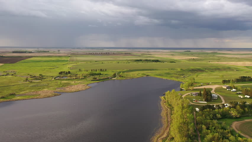 Aerial view of a campground, agricultural fields, lake in North Dakota. Spring Summer Seasons, sunny, before storm