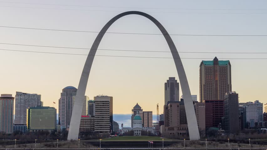 Missouri, FEB 23 2023 - Sunset to night time lapse of the skyline of St Louis with The Gateway Arch