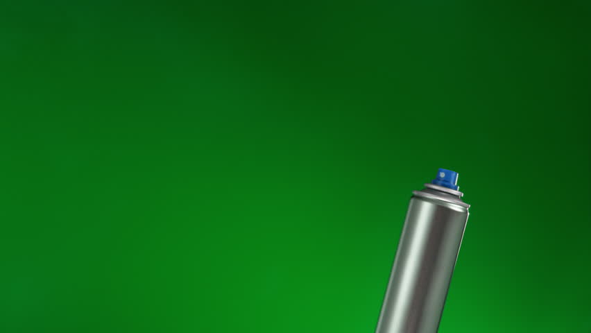 Spray can on green background sprays fountain of vaporized foam particles. stabilized locked shot at 60fps, color is a design and not a key color. Please choose black and alpha version for keying | Shutterstock HD Video #1101377823