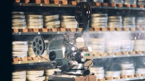 Retro technology, vintage old antique concept. Vintage video projector with smoke around it - Powered by Shutterstock - Get 15% off with code: PIKWIZARD15