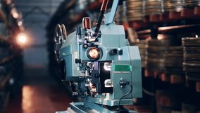 Antique movie projector while demonstrating a video