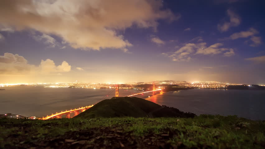 Time Lapse: Clouds and traffic on Golden Gate Bridge to San Francisco at night