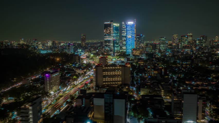 Aerial Timelapse with view of skyscrapers in Mexico City traffic avenue Royalty-Free Stock Footage #1101385265