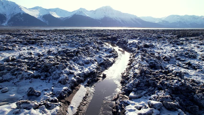 4k 23.98fps aerial video shot early Spring, in the Turnagain Arm, of the Cook Inlet. Anchorage, Alaska.